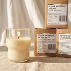Bougie Naturelle Joie en cire crème, flamme dorée, packaging kraft, ambiance wellness luxe