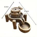 Un brûleur d'encens en cascade en bronze avec ses dimensions indiquées.