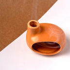 Un Brûleur d'Encens & Palo Santo en Céramique modèle Petite maison orange vue de dessus