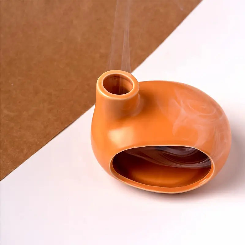 Un Brûleur d'Encens & Palo Santo en Céramique modèle Petite maison orange vue de dessus