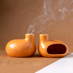 Deux brûleurs d'Encens & Palo Santo en Céramique modèle Petite maison orange côté à cote, l'un vue de face, l'autre vue de dos