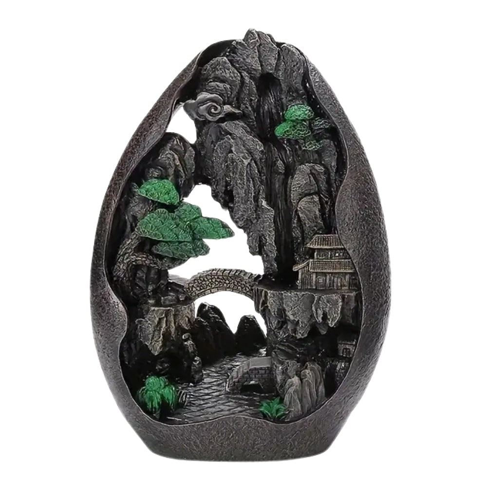 Un brûleur d'encens à refoulement cascade montagne sur fond blanc