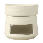 Un brûleur de cire ou d'huiles essentielles en céramique blanc