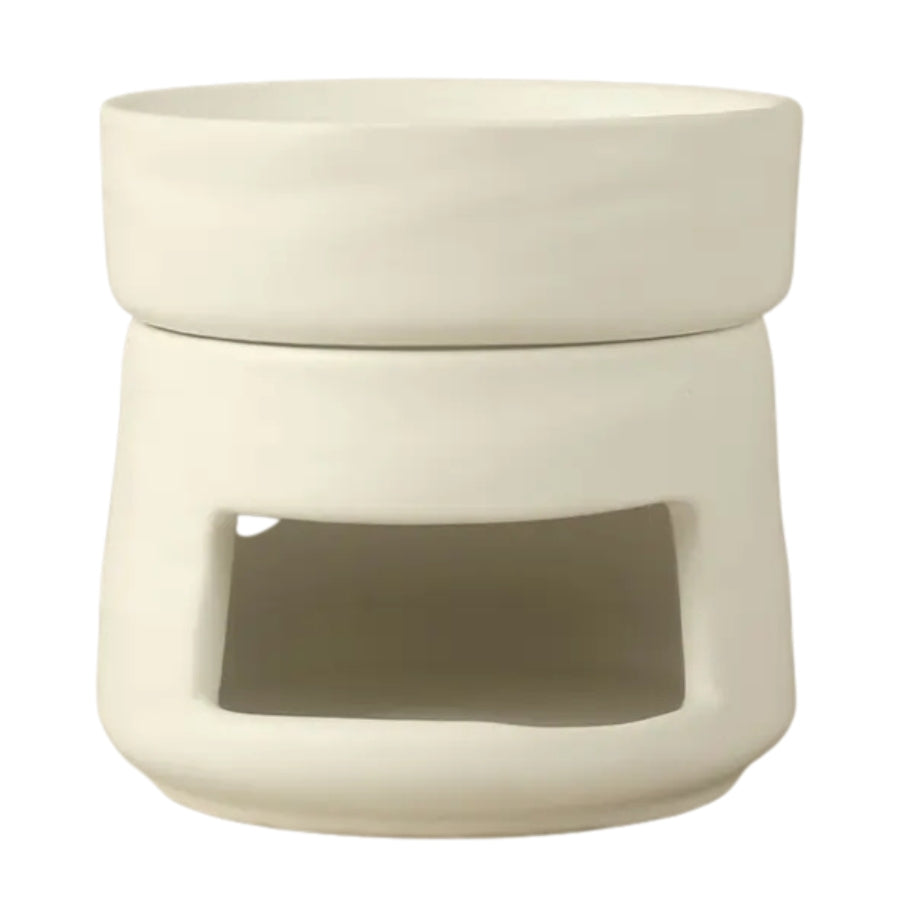 Un brûleur de cire ou d'huiles essentielles en céramique blanc