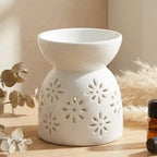 Diffuseur céramique soleil blanc avec motifs florés ajourés pour huiles et cires parfumées