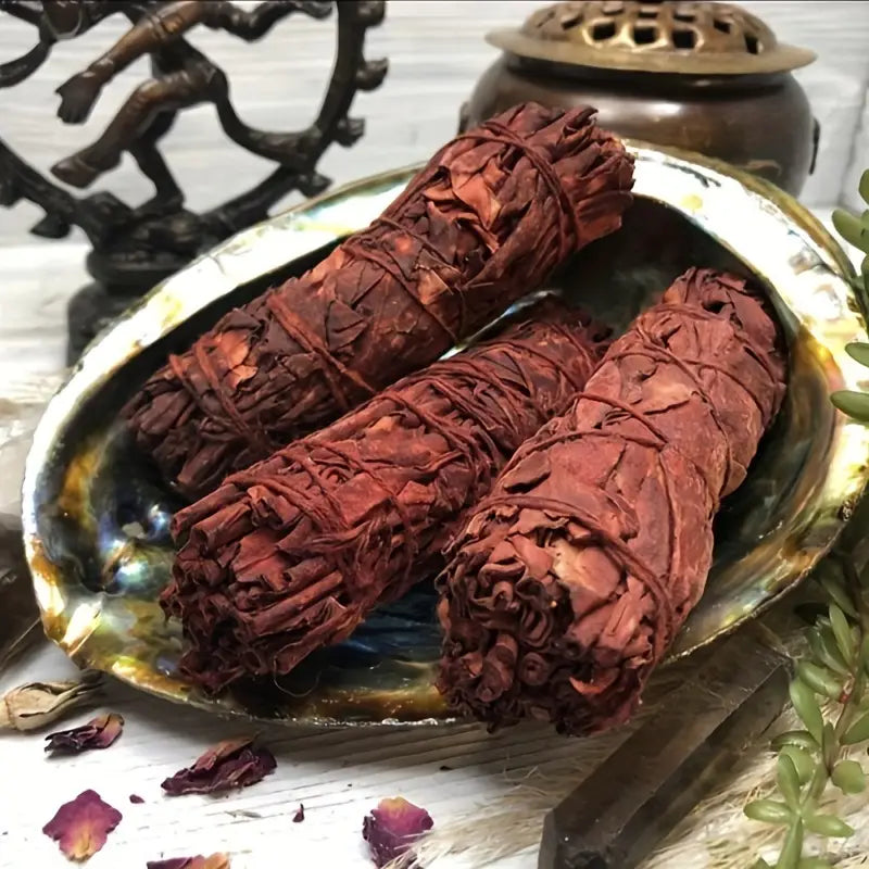 Trois Tresses de Sauge Sang de Dragon en train de bruler