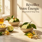 Spray Bergamote Ylang-Ylang 100ml avec fruits et fleurs sur marbre, ambiance énergisante