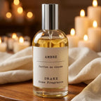 Spray ambiance Ambre Drake 100ml sur surface bois avec bougies, parfum Grasse luxe