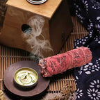 Une Tresse de Sauge Sang de Dragon en train de bruler